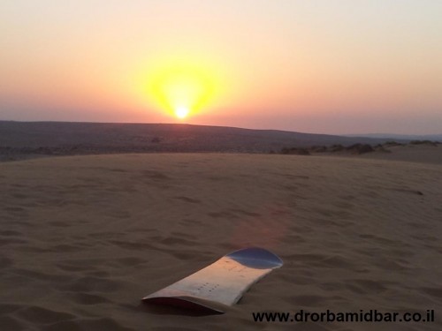 sandboarding in Israeli sunset